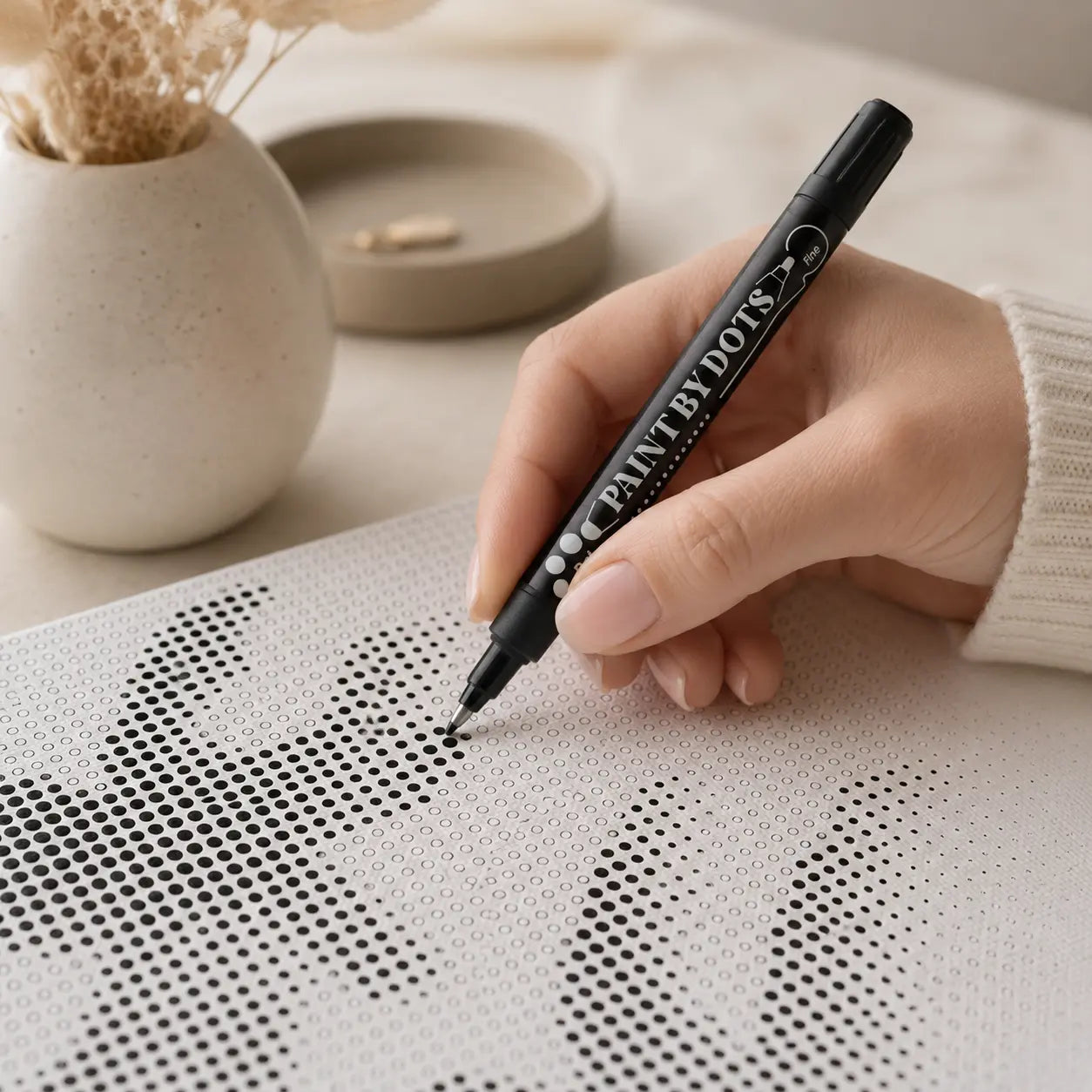 Dot painting kit being completed by hand as a thoughtful creative gift